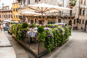 Verona, Italy  - June 26, 2017: Verona, Italy - Old Cozy outdoor cafe in Verona, Italy, Postcard of...