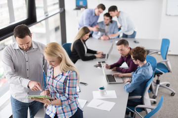 Two Business People Working With Tablet in office