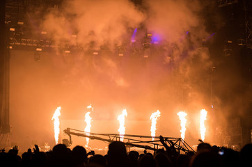 Flame projectors on a live EDM concert