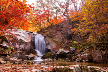 Gangwon-do Province, South Korea - Red leaves and Bangtaesan two-stage waterfall.