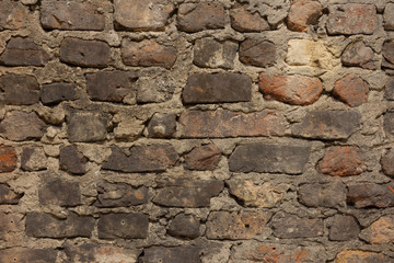 old dirty weathered brick wall with chalk paint remains