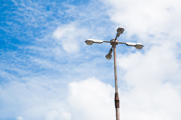 Modern street lamp against the blue sky.