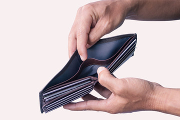 Empty Brown wallet in the hands of a freelancer isolated on background.
