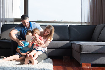 happy young couple spending time with kids