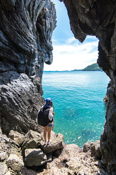 Travel people women tourist in a cave near the sea in Keo Sichang, Thailand. Travel Concept