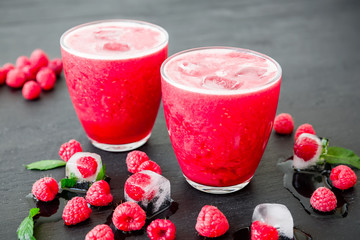 Fresh ice cold refreshing raspberry cocktail with berries