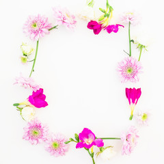 Obraz na płótnie Canvas Floral frame of pink flowers on white background. Floral composition. Flat lay, top view.