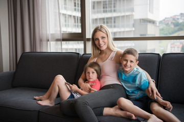 Fototapeta premium young mother spending time with kids