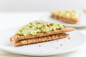 Wholemeal Bread Toast with mashed avocado and chilli flakes