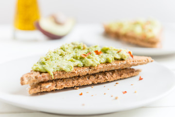 Wholemeal Bread Toast with mashed avocado and chilli flakes