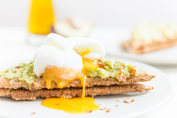 Wholemeal Bread Toast and Poached Egg with mashed avocado and ch