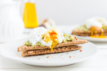Wholemeal Bread Toast and Poached Egg with mashed avocado and ch