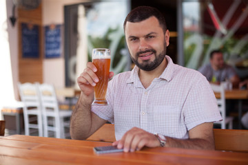 Handsome man drinking beer