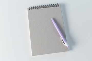 Color pencil and sketchbook on a table