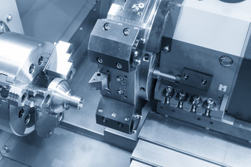 CNC lathe machine (Turning machine) cutting the metal  screw thread part .Hi-precision CNC machining concept.