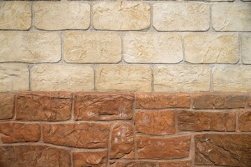 Brown and beige stone wall background texture