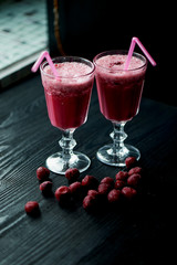 Fresh cool smoothie in a glass with a stem. Delicious and healthy Breakfast. Of cherries and strawberries