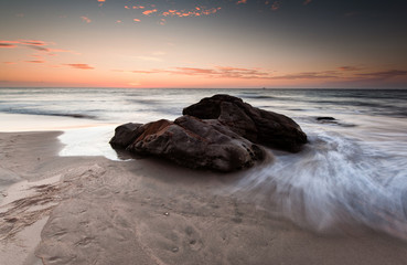 Fototapeta na wymiar Sunset with waves trail.