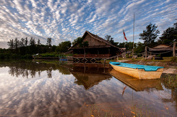 Fototapeta premium traditional house by the lake with reflection