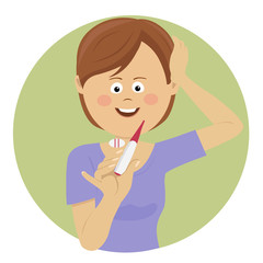 Young woman holding a pregnancy test with positive result