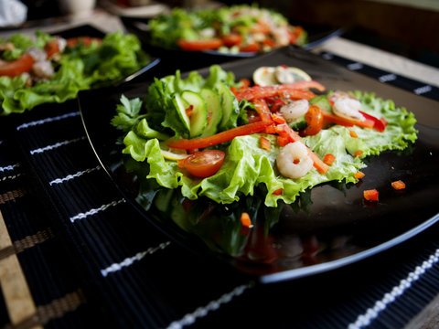 Delicious Salad Over Black Plate