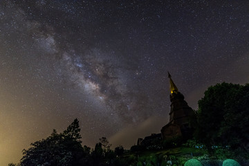milky way in starry night with pagoda on top of inthanon national park mountain at Chiang Mai, Thailand