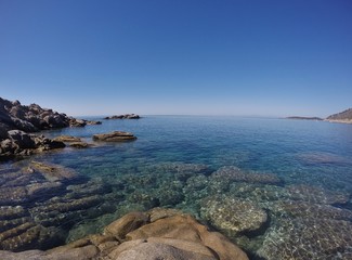 Fototapeta na wymiar Cavoli rocks and bay, Punta Fetovaia in the background. Elba island, Italy