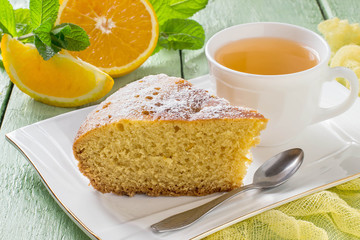 Orange pie and tea in a cup