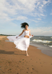 Fototapeta na wymiar White angel on the beach