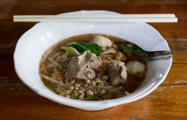 Spicy TOM YAM pork noodle soup with lemongrass, chilly pasted and lime juice.