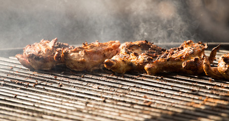 Pickled chicken fried on a large barbecue