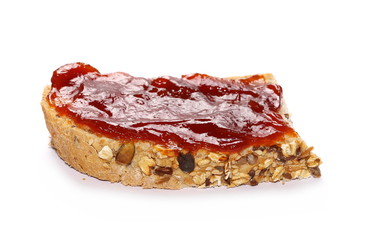 Whole wheat bread with marmalade isolated on white background © dule964