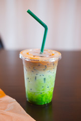 Ice coffee fusion three layer (espresso,milk and Matcha green tea)