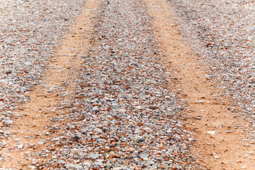 Road is strewn with rubble from pieces of concrete and brick