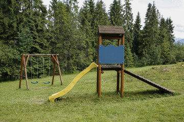 Fototapeta na wymiar kids playground on the mountain glade