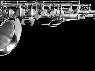 Saxophone isolated on black background.