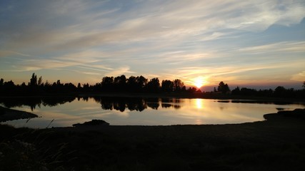 A sunset over the edge of the small lake!!  Serenity....!! Yes!!! 