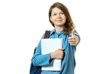 Portrait of a beautiful young student girl showing thumbs up