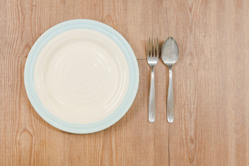 fork and spoon on dish