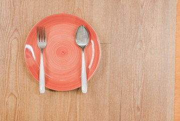 fork and spoon on dish