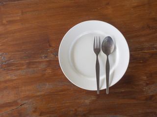 fork and spoon on white dish