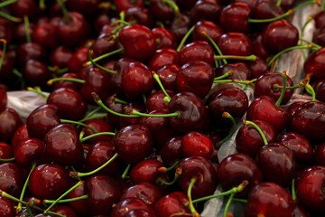 Fresh red cherries on retail market close up