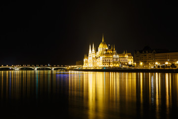 Fototapeta na wymiar View of Budapest with the Parliament building and Margaret Bridge at night