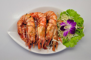 Grilled tiger prawns on white plate and white background