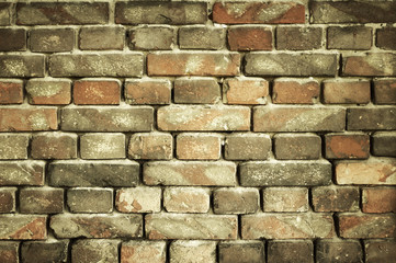 old brick wall for texture or background, yellow toned