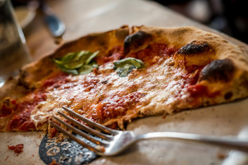 Delicious looking pizza in a restaurant setting 
