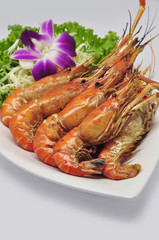 Grilled river prawns on white plate and white background
