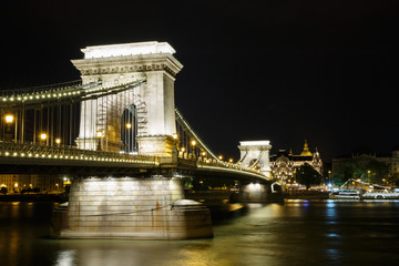 Night illumination of the chain bridge across the Danube to Budapest