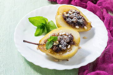 Baked pears with raisins, dates, honey, nuts, spices