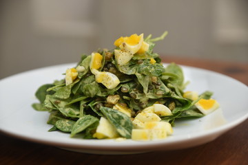 Dish of boiled eggs and greens 